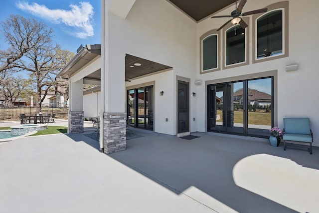 3905 Dashiell Dr, Flower Mound, TX 75022 - view of patio featuring fence, a ceiling fan, and a pool with connected hot tub