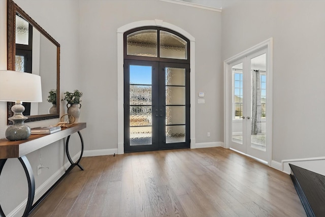 3905 Dashiell Dr, Flower Mound, TX 75022 - foyer with french doors, healthy amount of natural light, and wood finished floors