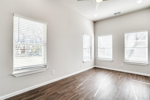 2316 Marburg St, Dallas, TX 75215 - spare room with baseboards, visible vents, a ceiling fan, and dark wood-style flooring