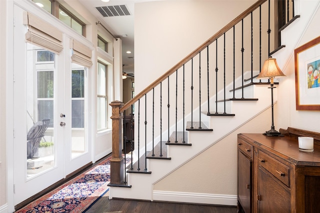 3703 Panalero Ln, Dallas, TX 75209 - foyer with dark wood-type flooring, french doors, recessed lighting, stairway, and baseboards