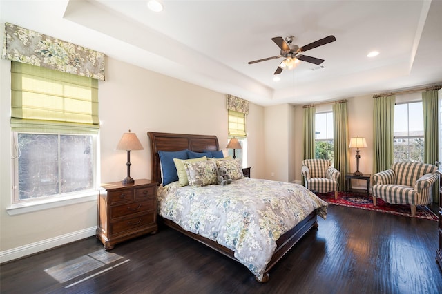 3703 Panalero Ln, Dallas, TX 75209 - bedroom featuring a tray ceiling, dark wood-style flooring, recessed lighting, baseboards, and ceiling fan