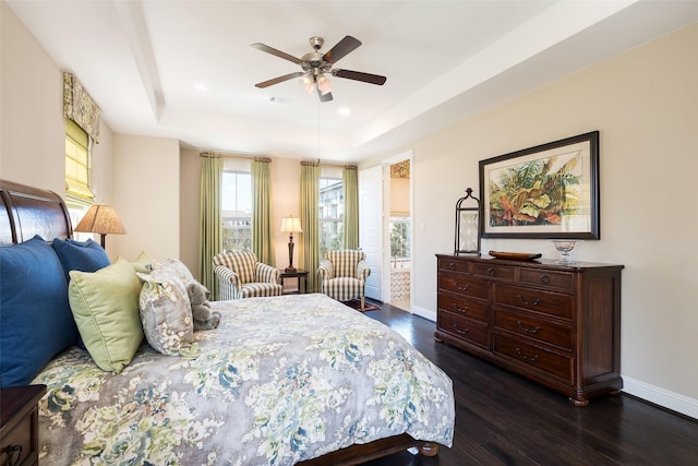 3703 Panalero Ln, Dallas, TX 75209 - bedroom with dark wood-style floors, a tray ceiling, baseboards, recessed lighting, and ceiling fan