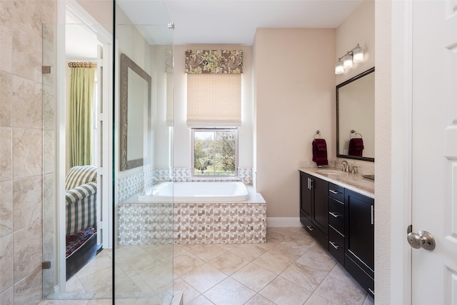 3703 Panalero Ln, Dallas, TX 75209 - bathroom featuring vanity, a garden tub, and tile patterned flooring