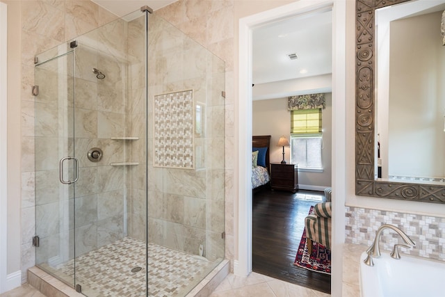 3703 Panalero Ln, Dallas, TX 75209 - bathroom featuring connected bathroom, a shower stall, baseboards, and tasteful backsplash