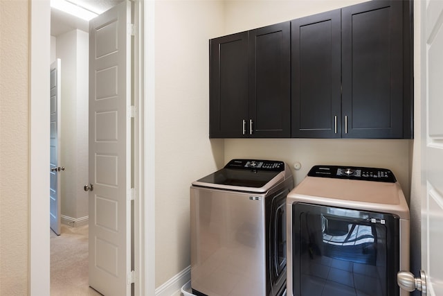 3703 Panalero Ln, Dallas, TX 75209 - washroom with washing machine and clothes dryer, cabinet space, and baseboards