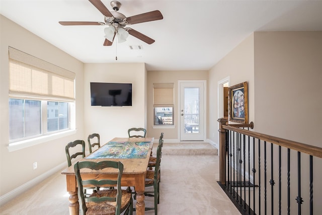 3703 Panalero Ln, Dallas, TX 75209 - dining space with light colored carpet, baseboards, and a ceiling fan