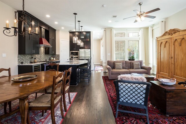 3703 Panalero Ln, Dallas, TX 75209 - dining room featuring dark wood-style floors, ceiling fan, wine cooler, and recessed lighting