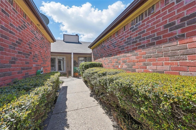 3217 Whatley Dr, Garland, TX 75043 - view of exterior entry featuring brick siding