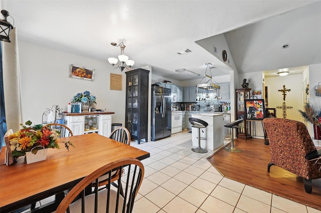3217 Whatley Dr, Garland, TX 75043 - dining room with a chandelier and light tile patterned floors