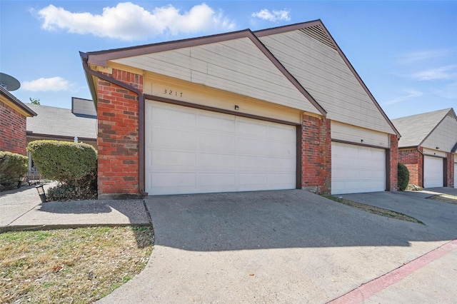 3217 Whatley Dr, Garland, TX 75043 - view of front of house with brick siding, concrete driveway, and an attached garage