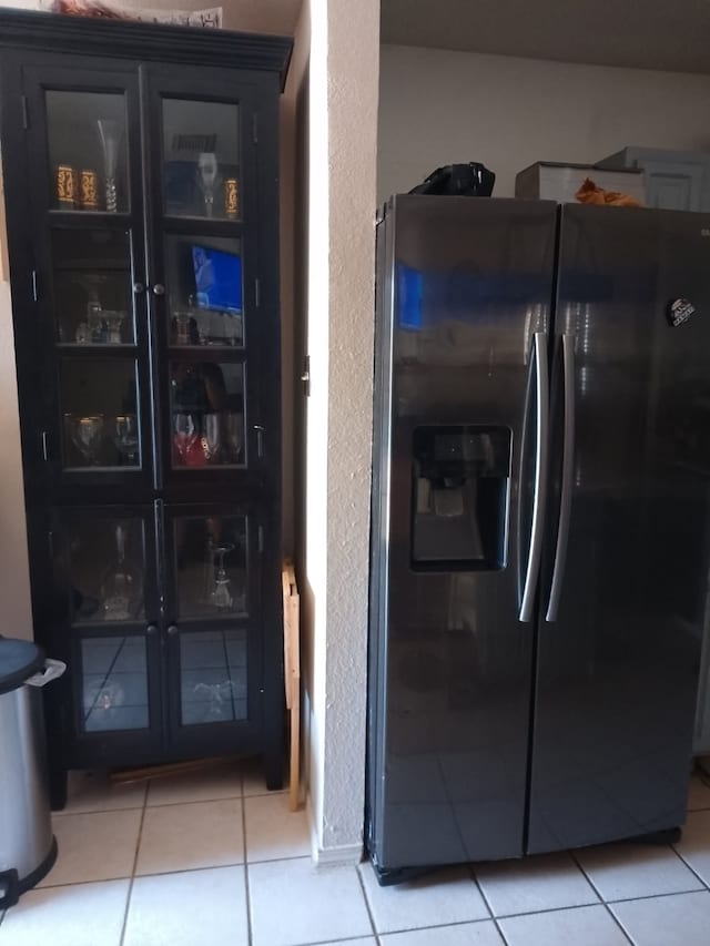 3217 Whatley Dr, Garland, TX 75043 - kitchen with fridge with ice dispenser and light tile patterned flooring