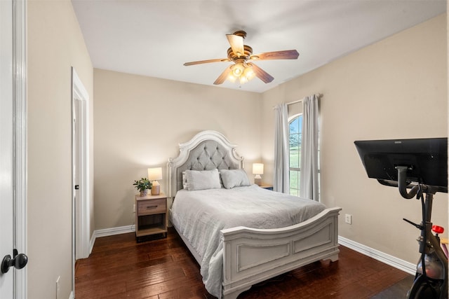 bedroom featuring a ceiling fan, baseboards, and dark wood finished floors