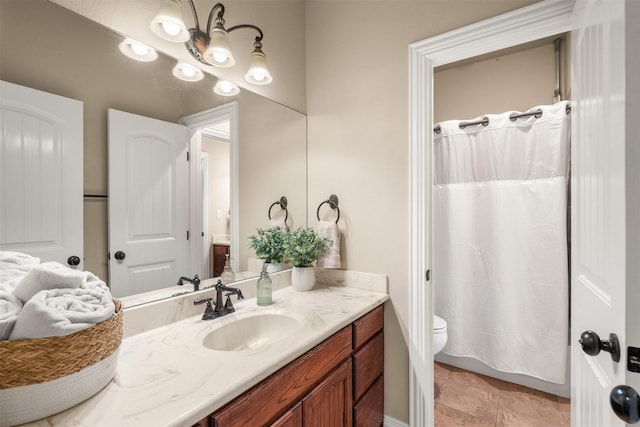 bathroom featuring vanity, a shower with shower curtain, and toilet