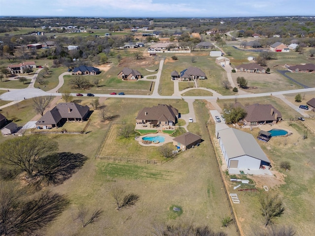 birds eye view of property with a residential view