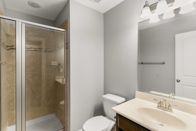 7813 Saint Clair Dr, Mckinney, TX 75071 - bathroom featuring visible vents, toilet, vanity, a stall shower, and a textured wall