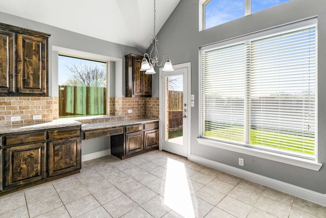 7813 Saint Clair Dr, Mckinney, TX 75071 - kitchen with plenty of natural light, a notable chandelier, and dark brown cabinets