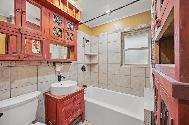 full bath featuring tasteful backsplash, vanity, toilet, shower / bathing tub combination, and tile walls