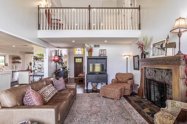 1125 Old Airport Rd, Weatherford, TX 76087 - living area featuring a high ceiling, a fireplace, wood finished floors, and recessed lighting