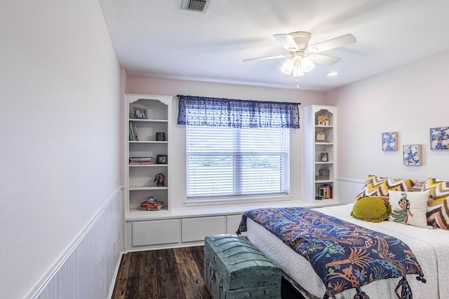 1125 Old Airport Rd, Weatherford, TX 76087 - bedroom with a wainscoted wall, visible vents, ceiling fan, and dark wood-style flooring