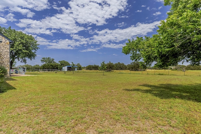 1125 Old Airport Rd, Weatherford, TX 76087 - view of yard featuring an outbuilding, fence, and a rural view