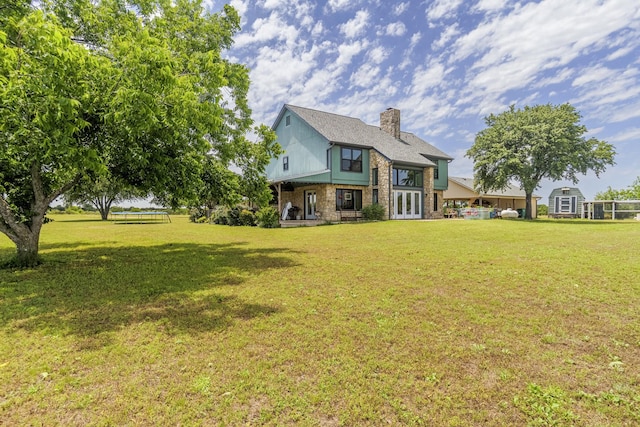 1125 Old Airport Rd, Weatherford, TX 76087 - rear view of property with a lawn, a chimney, and french doors