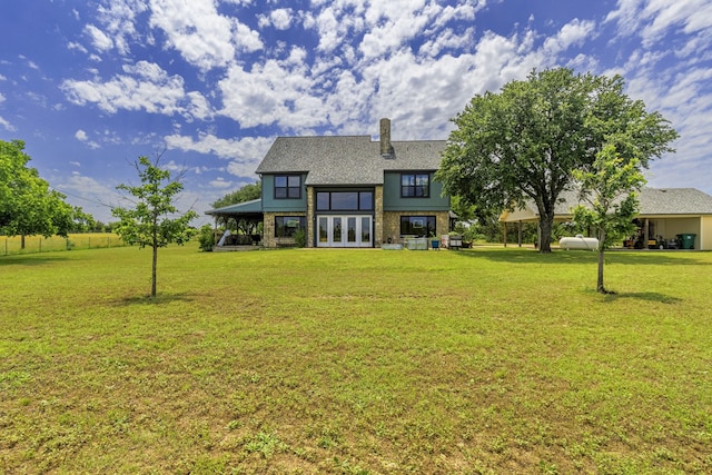 1125 Old Airport Rd, Weatherford, TX 76087 - back of house featuring french doors, a patio area, and a lawn