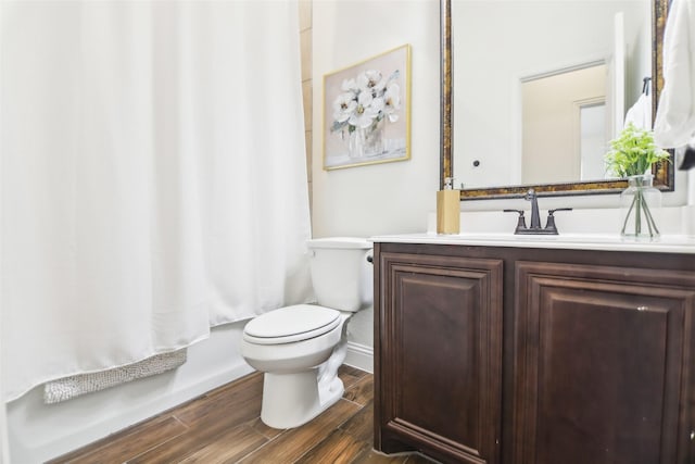 1236 Arrowwood Dr, Aubrey, TX 76227 - full bath with toilet, vanity, baseboards, and wood finished floors