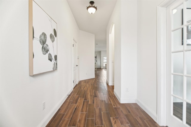 1236 Arrowwood Dr, Aubrey, TX 76227 - hallway with wood tiled floor, arched walkways, and baseboards