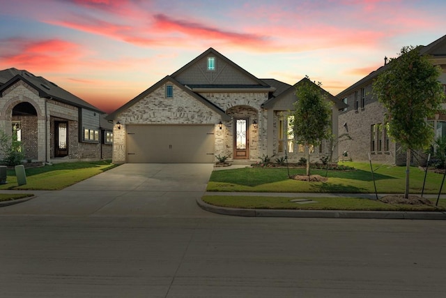 1236 Arrowwood Dr, Aubrey, TX 76227 - french country style house with a garage, a front lawn, and concrete driveway