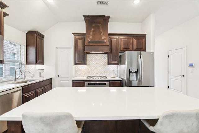 1236 Arrowwood Dr, Aubrey, TX 76227 - kitchen with light countertops, visible vents, stainless steel appliances, a sink, and vaulted ceiling