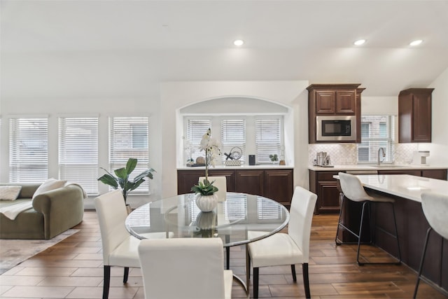 1236 Arrowwood Dr, Aubrey, TX 76227 - dining space with wood finished floors and recessed lighting