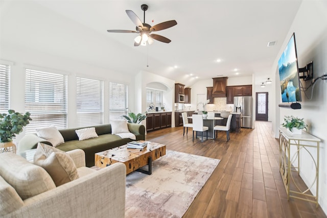 1236 Arrowwood Dr, Aubrey, TX 76227 - living area featuring vaulted ceiling, ceiling fan, recessed lighting, and dark wood-style flooring