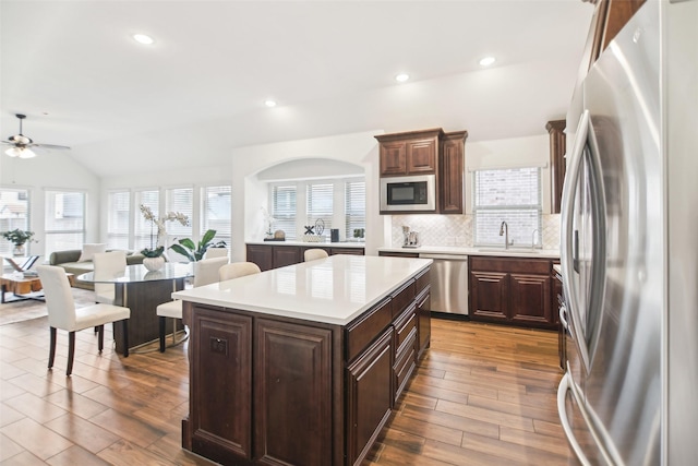 1236 Arrowwood Dr, Aubrey, TX 76227 - kitchen featuring light countertops, ceiling fan, tasteful backsplash, appliances with stainless steel finishes, and a sink