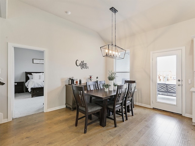 5024 Wilder Ave, Celina, TX 76227 - dining room featuring lofted ceiling, a chandelier, wood finished floors, and baseboards