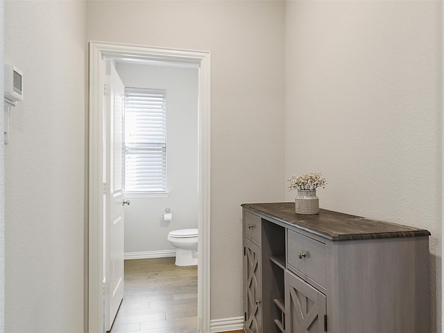 5024 Wilder Ave, Celina, TX 76227 - bathroom featuring toilet, wood finished floors, and baseboards