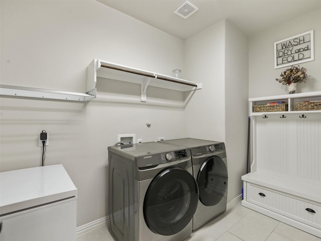 5024 Wilder Ave, Celina, TX 76227 - washroom with washer and clothes dryer, light tile patterned flooring, and baseboards