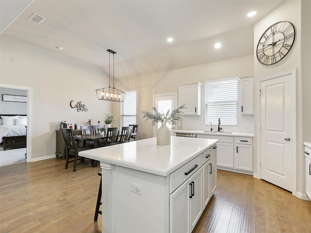5024 Wilder Ave, Celina, TX 76227 - kitchen featuring a sink, recessed lighting, light wood-style floors, white cabinets, and tasteful backsplash