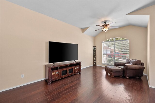 living room with baseboards, lofted ceiling, wood finished floors, and ceiling fan