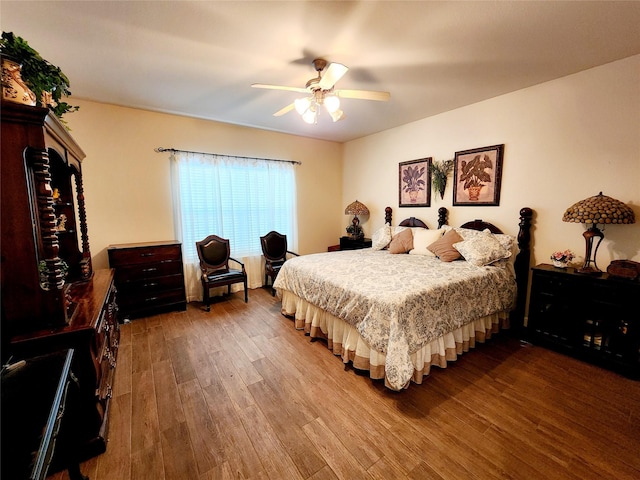 bedroom featuring a ceiling fan and wood finished floors