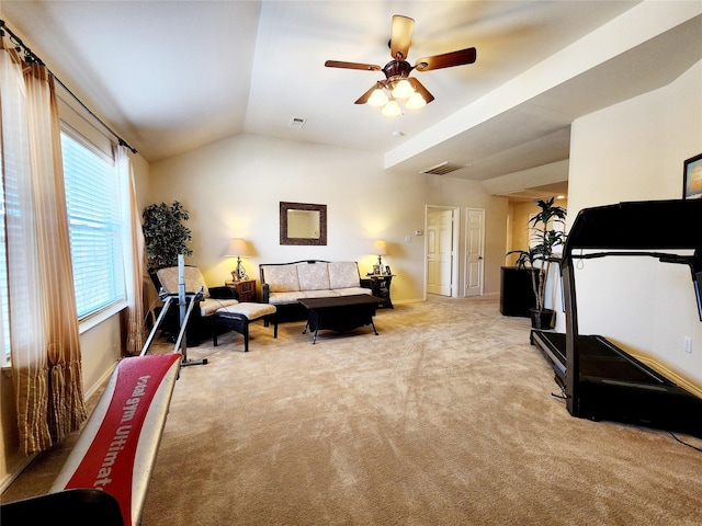 living area featuring light colored carpet, visible vents, baseboards, vaulted ceiling, and a ceiling fan