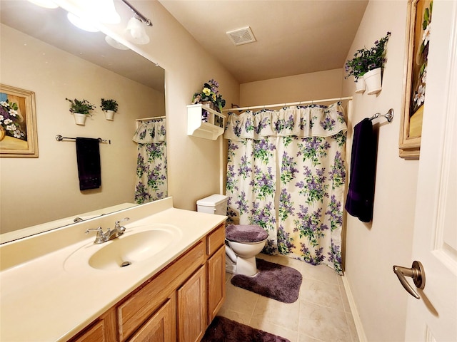 full bath featuring tile patterned floors, toilet, vanity, baseboards, and visible vents