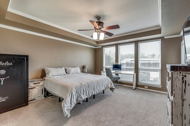 5440 Sycamore Dr, Midlothian, TX 76065 - bedroom featuring a tray ceiling, ornamental molding, light colored carpet, and ceiling fan