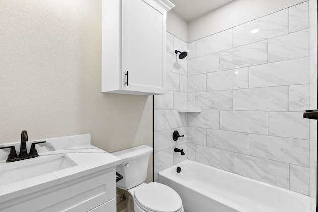 bathroom with vanity,  shower combination, and toilet