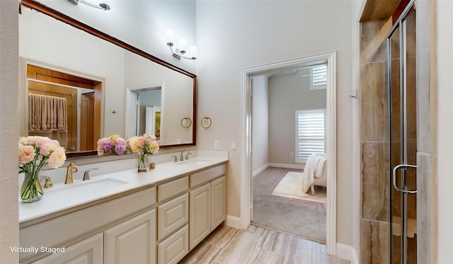 1051 Copper Canyon Dr, Prosper, TX 75078 - bathroom featuring double vanity, a shower stall, baseboards, and wood finished floors