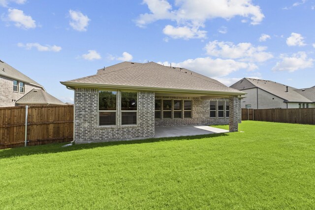 1330 Caleb Rd, Van Alstyne, TX 75495 - back of house with brick siding, a patio area, and roof with shingles