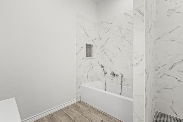 bathroom with wood tiled floor and baseboards