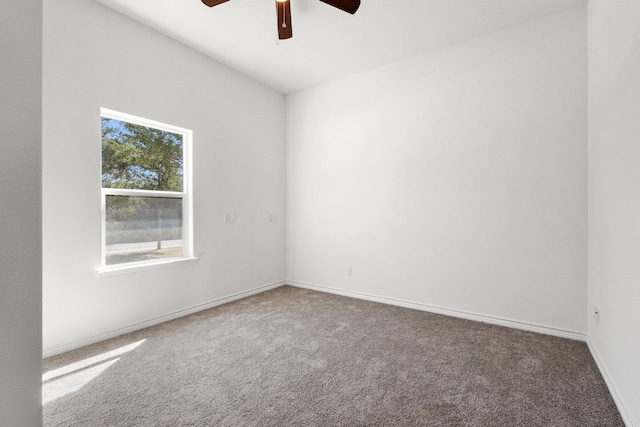 unfurnished room featuring baseboards, ceiling fan, and carpet floors