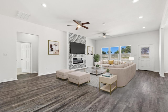 living room featuring visible vents, ceiling fan, dark wood-type flooring, and recessed lighting