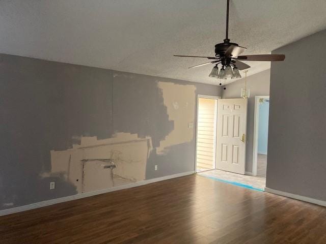 4220 Staghorn Cir N, Fort Worth, TX 76137 - unfurnished living room with a ceiling fan, wood finished floors, lofted ceiling, a textured ceiling, and baseboards