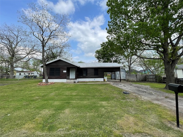 106 N 4th St, Celeste, TX 75423 - view of front of home with driveway, a front yard, entry steps, metal roof, and fence